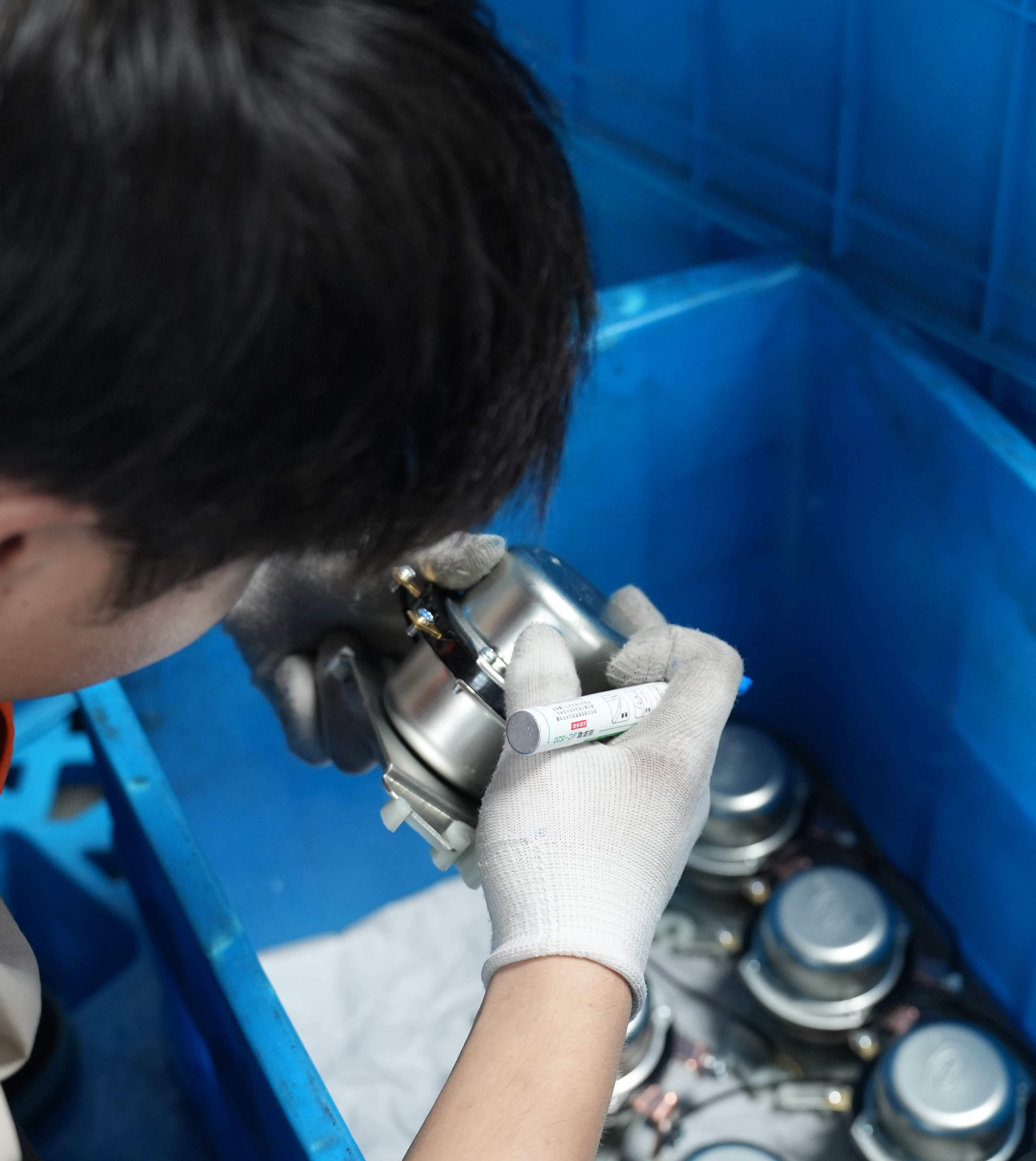 Battery relay inventory stored in labeled blue bins on warehouse shelves