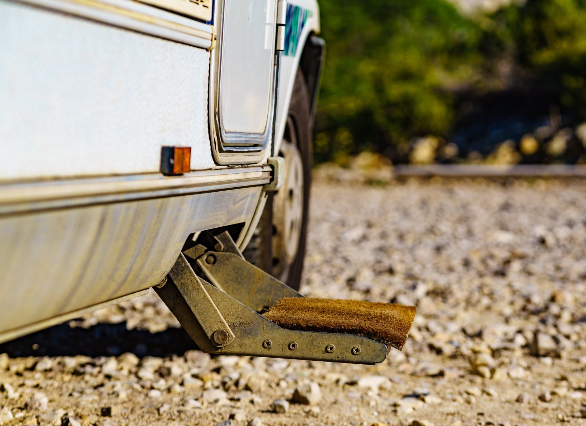 Vintage truck with a fold-down metal step beside the rear wheel