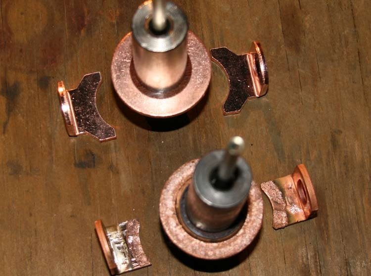 New and worn starter solenoid plungers and copper contacts side by side